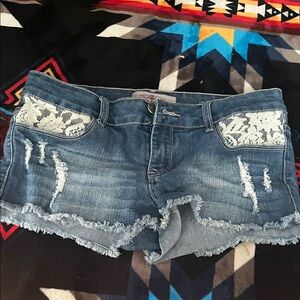 Lace-Accent Distressed Blue Jean Shorts